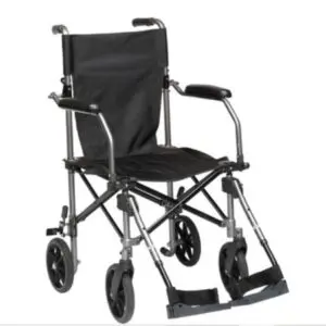 The Drive TraveLite Aluminium Transport Chair, featuring a black metal frame, armrests, footrests, and four wheels, is shown on a plain white background.