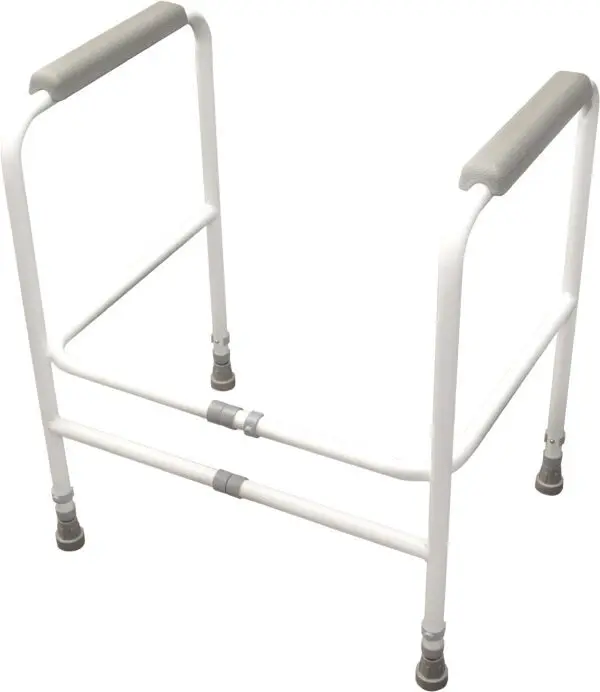 The Broadstairs Toilet Frame with Adjustable Height and Width features a white metal safety frame with padded armrests, designed to assist users with sitting and standing when placed around a toilet.