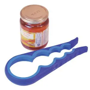 The Aidapt Universal 4-in-1 Jar and Bottle Opener in purple is placed next to a sealed glass jar of honey with a gold lid.