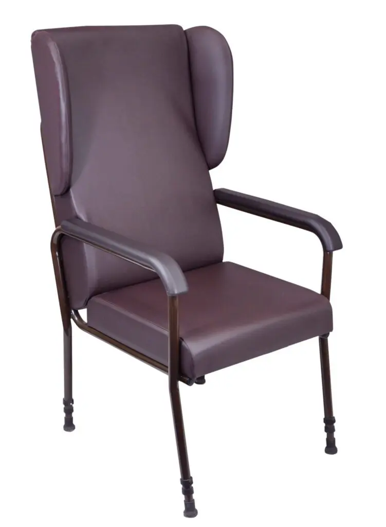 The Chelsfield Height Adjustable Chair is a high-backed, brown upholstered armchair featuring winged sides, a metal frame, and rubber-tipped legs.