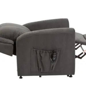 The Memphis Riser Recliner in grey upholstery is shown fully reclined, with its footrest extended and a side pocket holding a remote control.