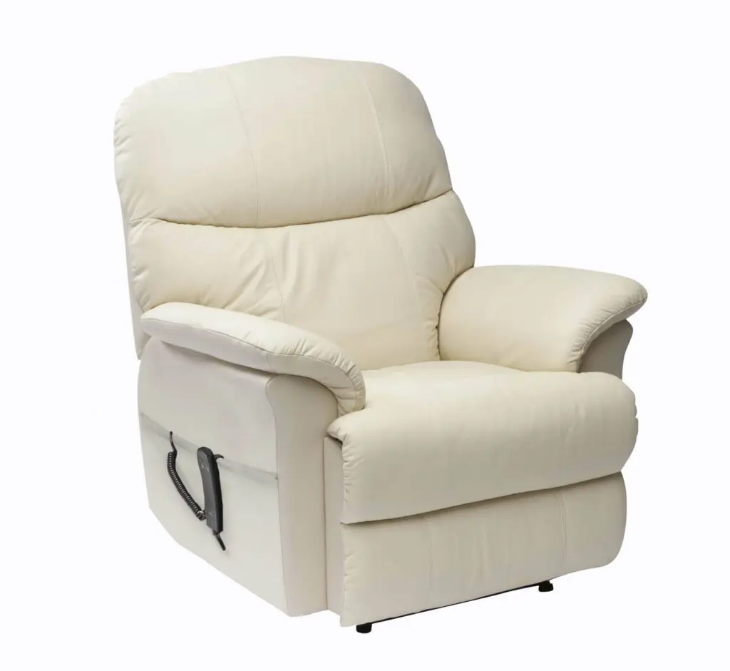 The Lars Dual Riser & Recliner, a beige leather chair with padded armrests and backrest, features a side lever for reclining and is displayed against a plain white background.