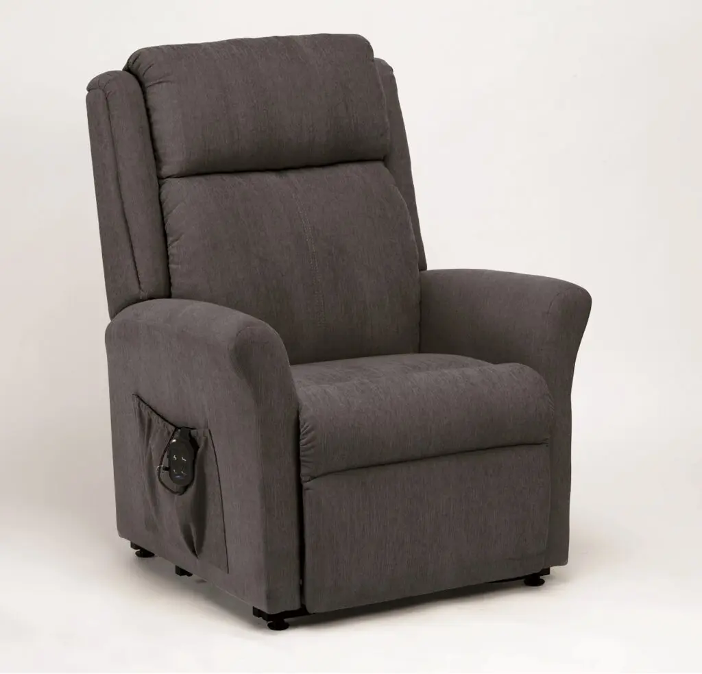 The Memphis Riser Recliner, upholstered in grey and featuring a side pocket, is displayed against a plain white background.
