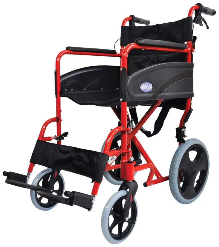 The Compact Transport Aluminium Wheelchair is a red, lightweight model with black seat, armrests, and footrests, featuring large rear wheels and small front wheels.