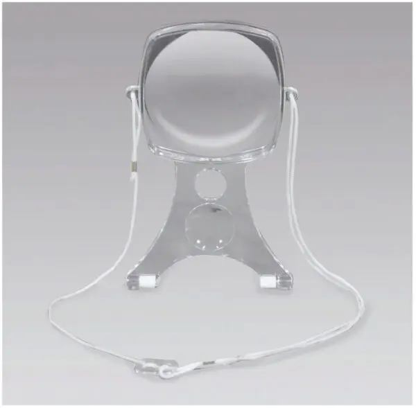 The Handsfree Craft Magnifier, made of clear acrylic with a stand and a white neck cord, displayed on a plain grey background.