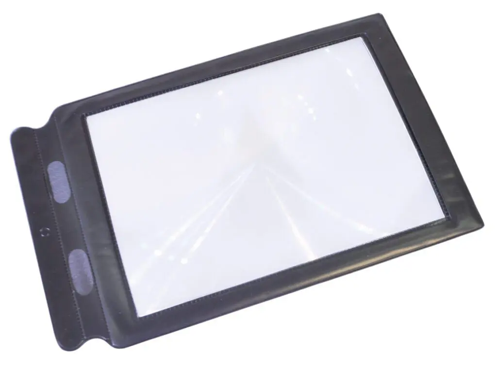 The Sheet Magnifier is a rectangular handheld magnifying sheet with a black frame for enlarging text or images, shown on a white background.
