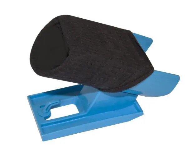 The Sock Aid Slider is a blue plastic slip-on shoe aid with a black fabric cradle designed to help users slide shoes onto their feet more easily.