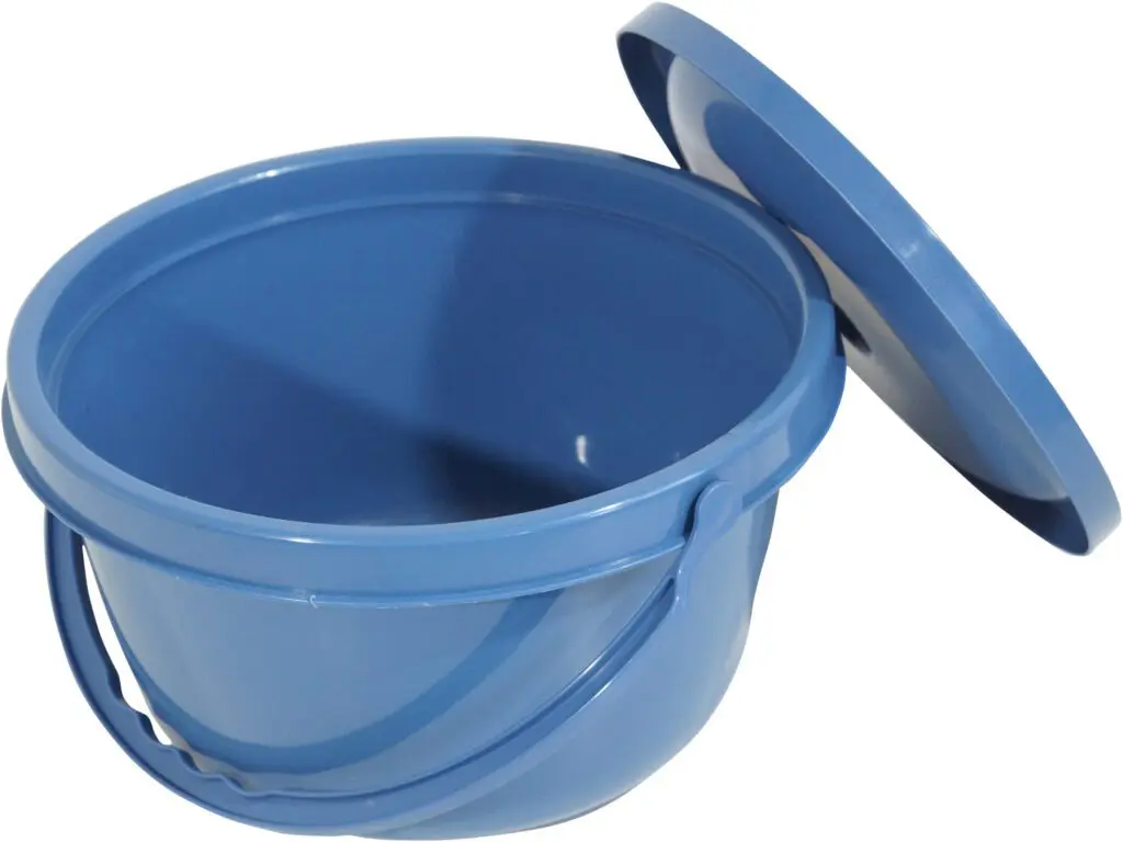 A Folding Commode with a handle and a matching lid placed to the side.