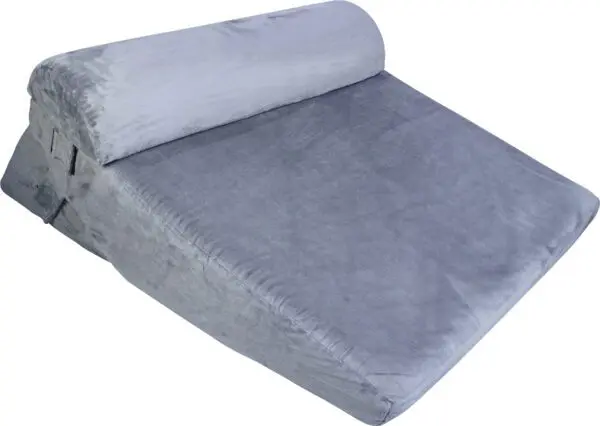 The Luxury Folding Adjustable Bed Wedge Pillow is grey, wedge-shaped with a soft fabric cover and attached bolster, designed for comfortable support and elevation.