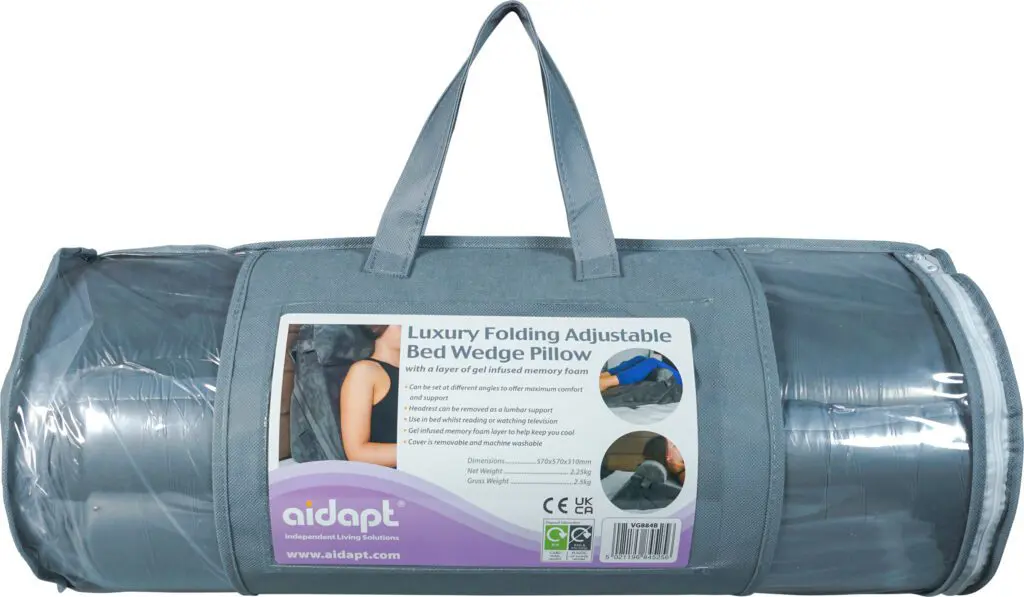 A grey carrying case contains the Luxury Folding Adjustable Bed Wedge Pillow, with a label displaying product details and usage instructions.