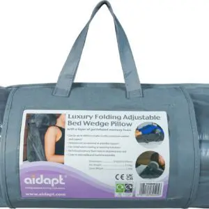 A grey carrying case contains the Luxury Folding Adjustable Bed Wedge Pillow, with a label displaying product details and usage instructions.
