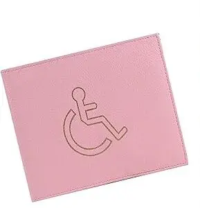 A pink wallet featuring an engraved international accessibility symbol showing a figure in a wheelchair.