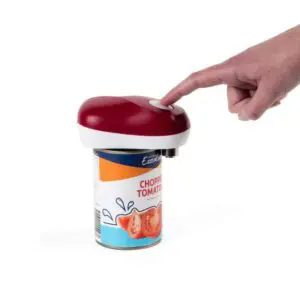 A hand presses the button on the Automatic Can Opener, which is placed on top of a tin of chopped tomatoes.
