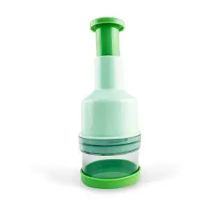 The Food Chopper is green and white, features a transparent container base, and has a manual push-down handle.
