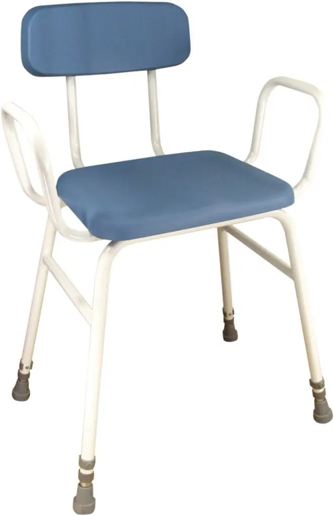 The Astral Perching Stool features a blue cushioned seat and backrest, sturdy white metal frame, armrests, and rubber-tipped legs.