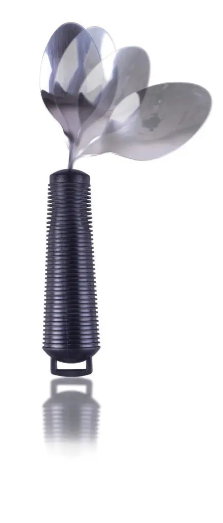 A Bendable Cutlery Set (6 piece) with black handles is shown on a white background, featuring one utensil's metal head in three positions to illustrate its rotating or swinging motion.