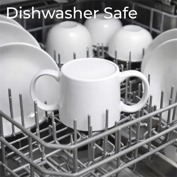 A white double-handled cup sits upright in a dishwasher rack among plates and bowls. The text “Dishwasher Safe” appears at the top.