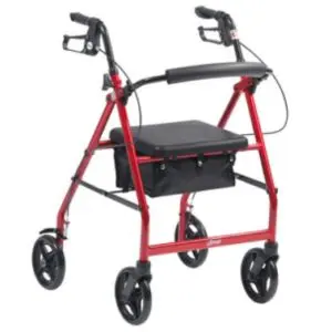 A red four-wheeled rollator with hand brakes, a black padded seat, and a storage pouch underneath.