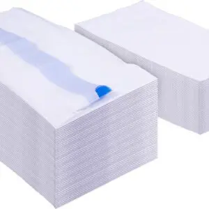Two large stacks of rectangular white Commode Liners with Absorbent Pads (Box of 50), one stack partially covered by a single unfolded pad showing its blue adhesive strip.