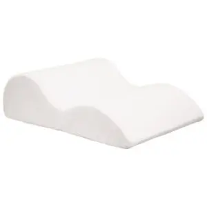 The Foam Leg Raiser is a white, contoured orthopaedic pillow with two elevated sections that support your legs and encourage proper spinal alignment.