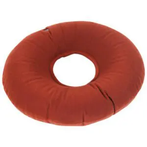 The Inflatable Pressure Relief Ring Cushion is a round, brown cushion with a central hole, designed for medical or seating support.
