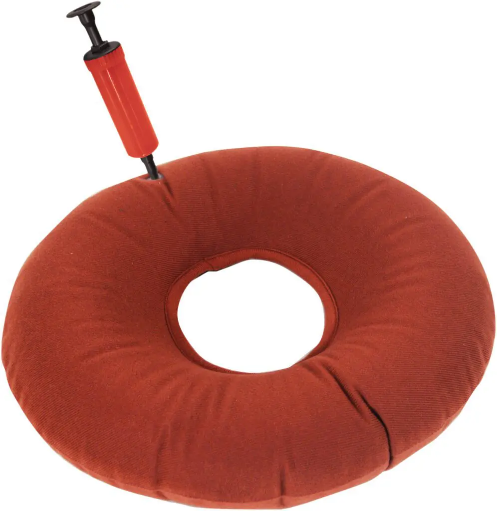 The Inflatable Pressure Relief Ring Cushion is a red, doughnut-shaped cushion with a central hole, shown with an attached hand pump for inflation.