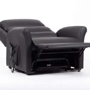 The Alaska Extra Large AM-PVC Crib 5 Dual Motor Riser Recliner in black is displayed with its footrest extended, set against a plain white background.