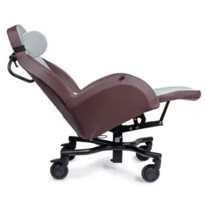 The Integra Shell Chair is a brown medical recliner with castors, adjustable backrest, and leg support, shown fully reclined against a white background.