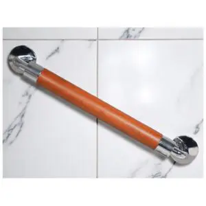 The Modern Grab Rail 400mm with chrome ends is mounted on a white and grey marble tile wall.