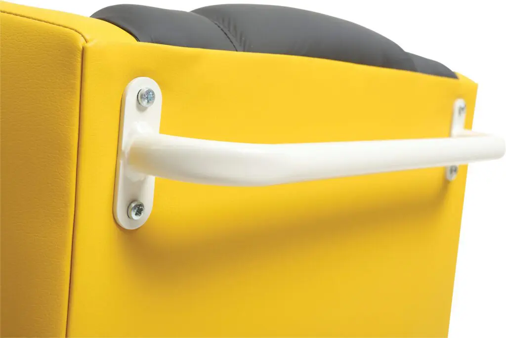 Close-up of a white metal handle secured with screws to the side of the yellow and black cushioned Brookfield Dual Motor Rise & Recliner Chair.