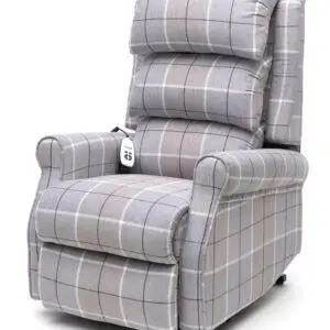 The Broadway Dual Motor Riser Recliner Chair is a grey check upholstered recliner with padded armrests and backrest, featuring a remote control attached to the side.