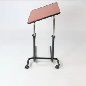 Economy Overbed Table featuring a red slanted tabletop, black metal frame, and four castor wheels, shown against a plain white background.