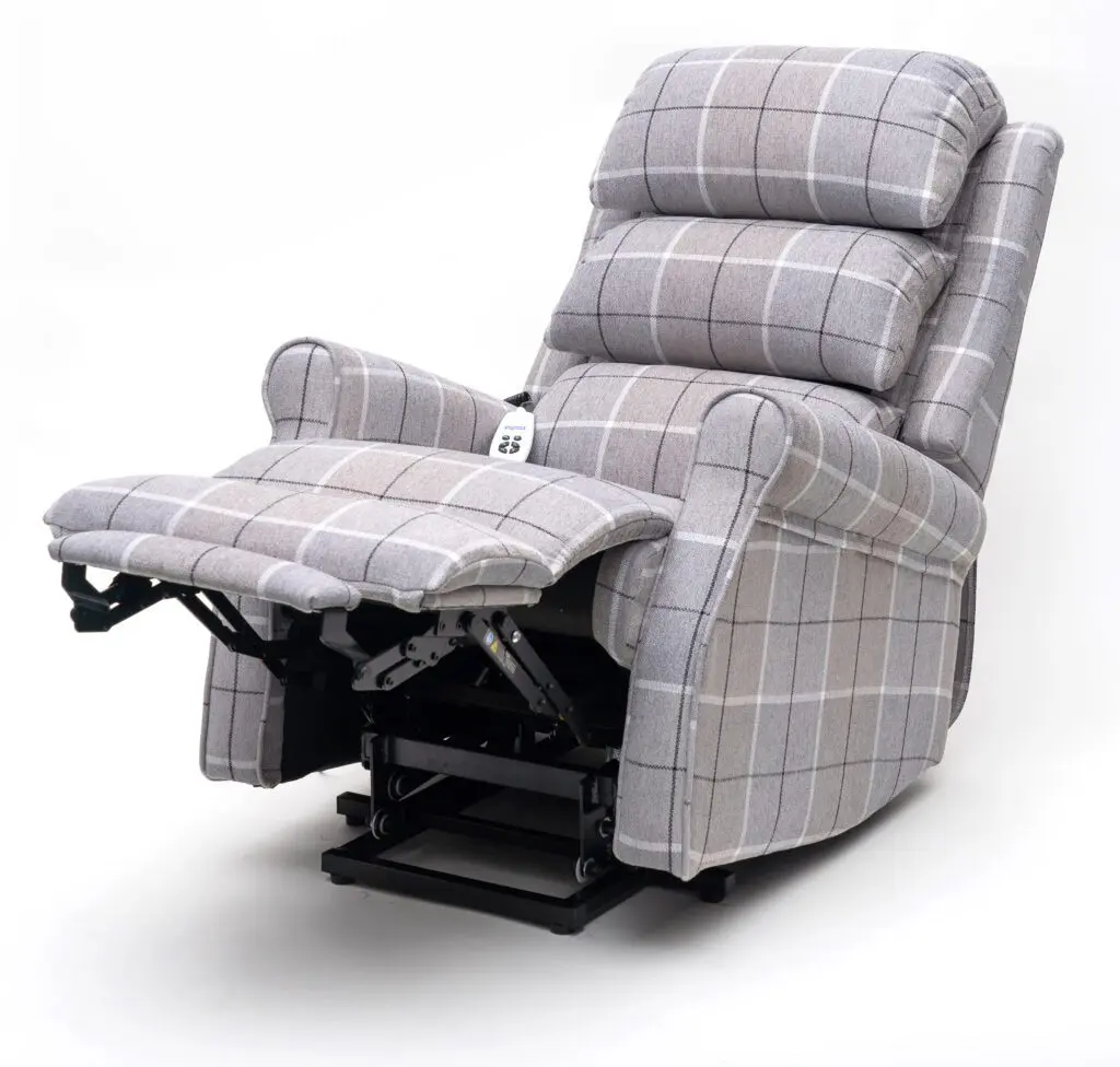 The Broadway Dual Motor Rise and Recline Chair, in grey check upholstery, features a raised footrest and is displayed against a white background.