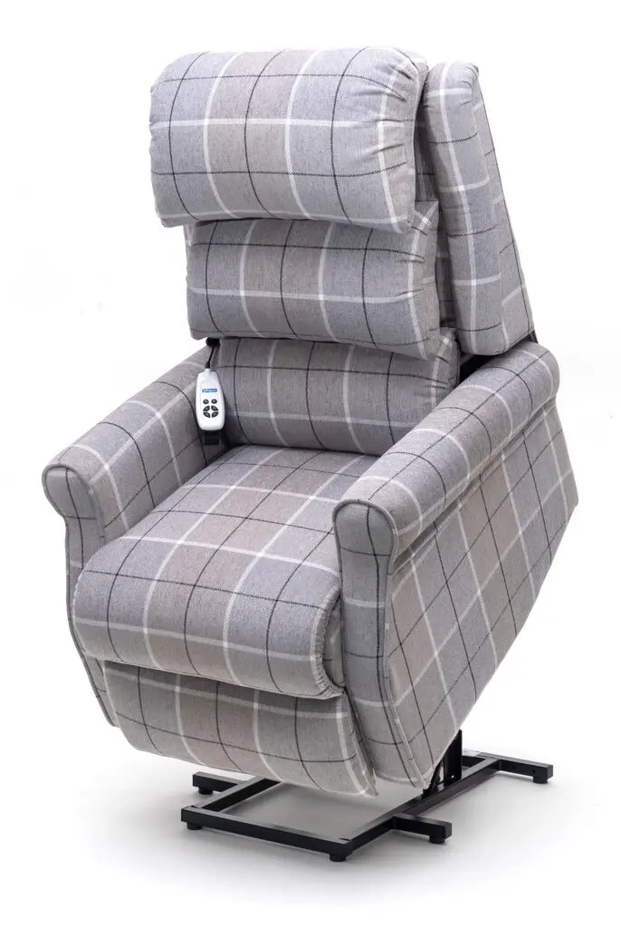 The Broadway Dual Motor Rise and Recline Chair features grey check upholstery, a remote control, and a sturdy metal base to assist users in standing up.