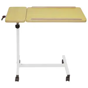 The Deluxe Multi-Purpose Overbed Wheeled Table features a light wood top, white metal frame, and four castor wheels. One side of the tabletop is slightly raised and smaller for versatile use.
