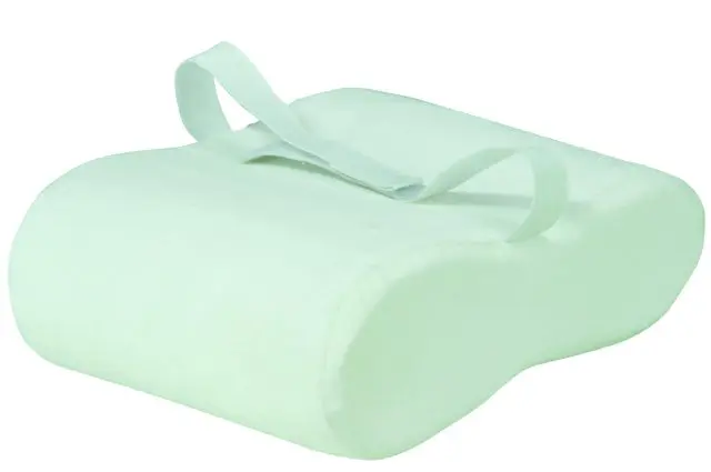 The Memory Foam Leg Pillow is a white orthopaedic knee pillow with a contoured shape and an elastic top strap, designed to provide leg support during sleep.