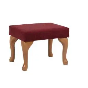 Small wooden stool with four curved legs and a rectangular, red cushioned seat. The stool is set against a plain white background.