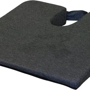 The Coccyx Wedge Cushion is a black, wedge-shaped seat cushion with a U-shaped cut-out and a handle on the back.