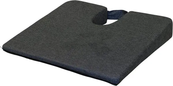 The Coccyx Wedge Cushion is a black, wedge-shaped seat cushion with a U-shaped cut-out and a handle on the back.