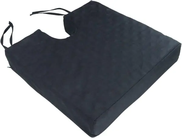 The Deluxe Pressure Relief Orthopaedic Coccyx Cushion is a black rectangular foam cushion with a coccyx cut-out, textured surface, and attached straps for secure wheelchair placement.