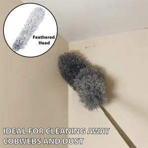 A grey duster from the 5 Piece Professional Duster Kit with Extendable Telescopic Pole clears cobwebs from a ceiling corner; inset highlights the duster head. Text reads: "Perfect for cleaning away cobwebs and dust.