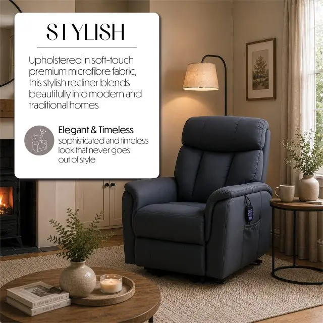 The Billingham Dual Motor Rise and Recline Chair, upholstered in a dark fabric, sits in a cosy living room next to a lit floor lamp, a round wooden table, and a fireplace adorned with a plant above the mantelpiece.