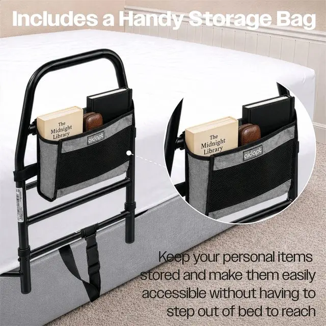 Black Solo Bed Transfer Aid with an attached storage pocket containing a book, a notebook, and a small case, shown on a bed.