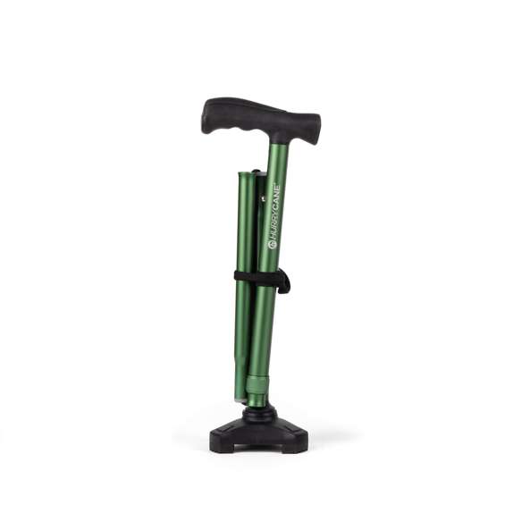 The HurryCane Walking Stick, featuring a green foldable shaft with a black handle and base, stands upright on a white background.