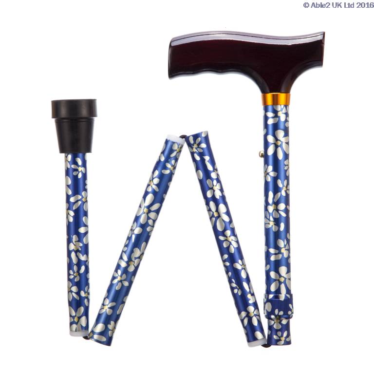 A blue folding walking stick with a white floral pattern, a wooden handle, and a black rubber tip, shown in a partially collapsed state.