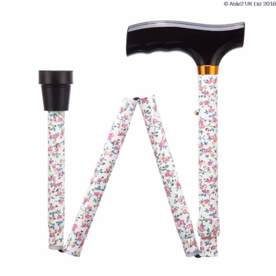 A folding walking stick with a black handle and a floral-patterned shaft, shown partially collapsed to display its foldable design.