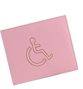 A pink wallet featuring an engraved international accessibility symbol showing a figure in a wheelchair.