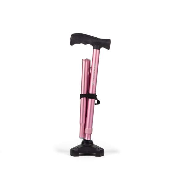 A pink folding walking stick with a black handle and rubber tip, standing upright against a white background.